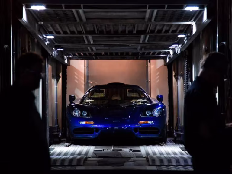 enclosed auto transport carrier protecting luxury vehicles