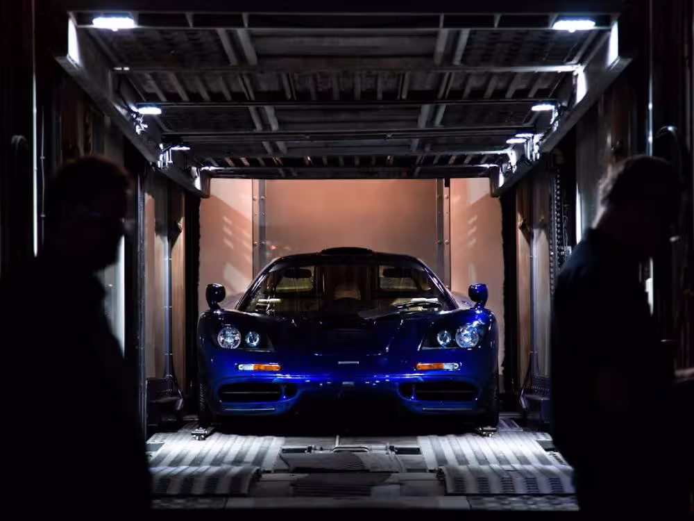 enclosed auto transport carrier protecting luxury vehicles